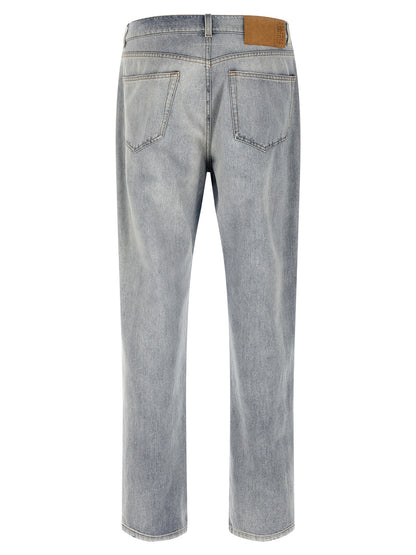 Jeans by MM6 Maison Margiela for men in denim cotton light-blue, white & signature presents a tailored silhouette, showcasing a tailored straight-leg, relaxed-fit & wide and long cut with a refined for a truly tailored aesthetic.