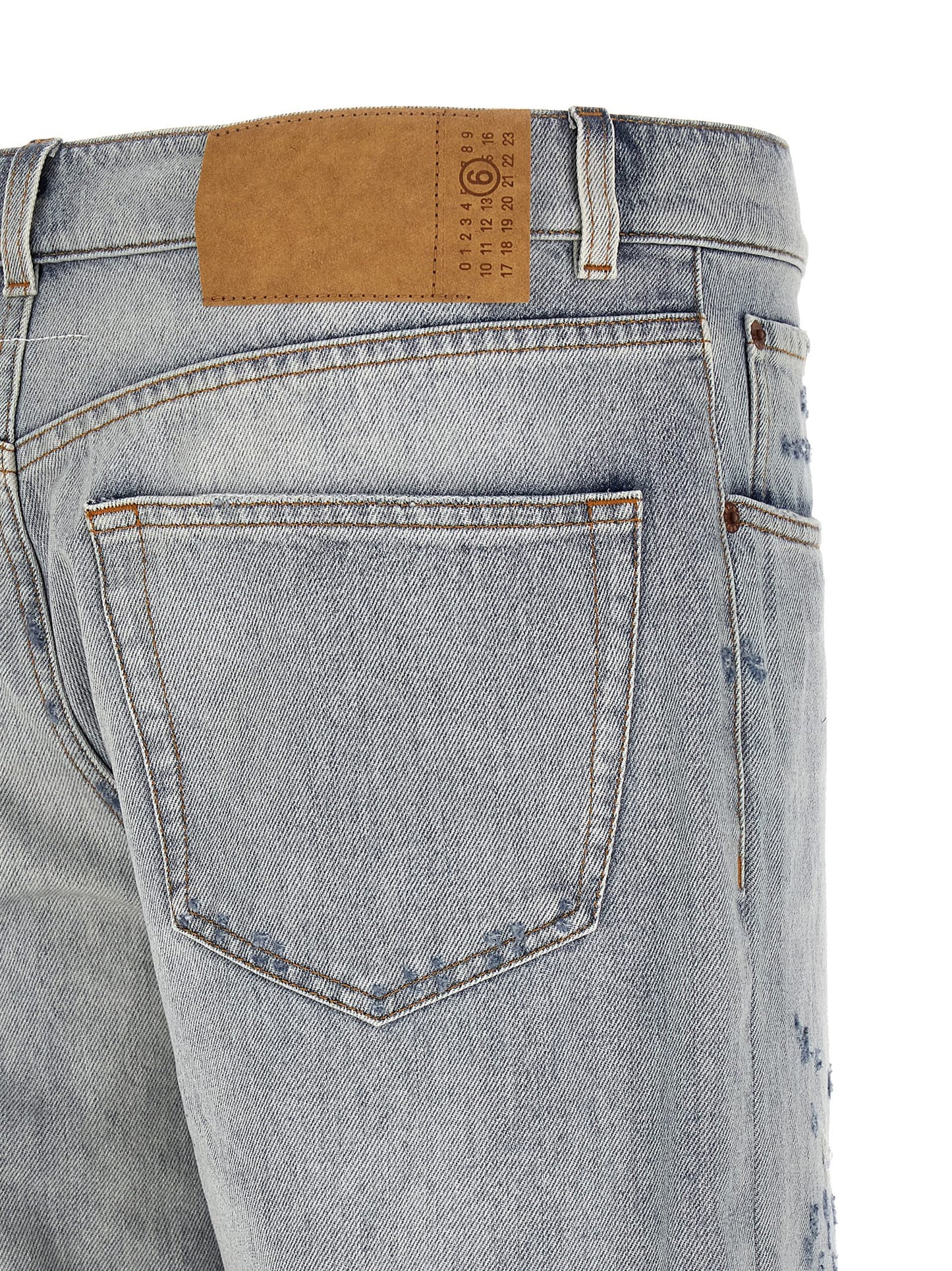 Jeans by MM6 Maison Margiela for men in denim cotton light-blue, white & signature features a refined silhouette with a refined straight-leg, relaxed-fit & wide, defined by a and a refined long for a refined finish.