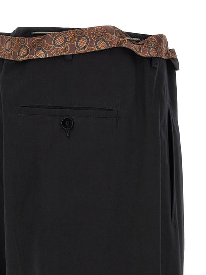 Casual Pants by Magliano for men in cotton black presents a tailored silhouette, showcasing a tailored wide and long cut with a refined for a truly tailored aesthetic.