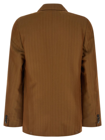This Blazer by Dries Van Noten for men in wool & viscose brown, patterned & pinstripe presents a tailored silhouette, meticulously tailored with a tailored and distinctive for a tailored finish.