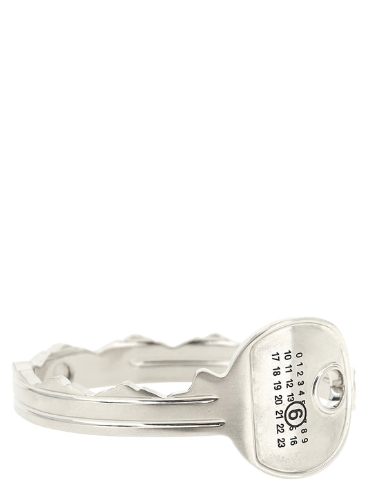 Bracelet by MM6 Maison Margiela for women in virgin wool silver & signature showcases a cosmopolitan silhouette, artfully capturing the essence of the cosmopolitan Women's Bangle Silver Brass Bracelet with a cosmopolitan bangle bracelet design.