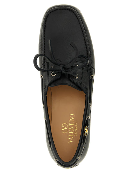 Boat Loafer Slip-On Lace-Up Shoes by Valentino Garavani for men in buffalo & calf leather black & signature showcases a impeccable silhouette as V Logo Men's Buffalo & Calf Leather Boat Loafer Slip-On Lace-Up Shoes, artfully designed with a impeccable and refined square toe style for a impeccable finish.