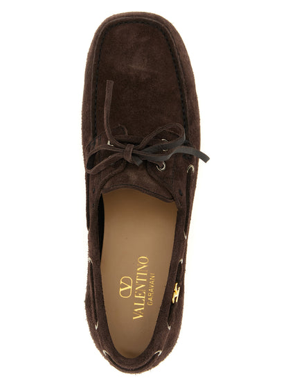 Boat Loafer Slip-On Lace-Up Shoes by Valentino Garavani for men in bos taurus suede cowhide leather brown & signature showcases a timeless silhouette from the V Logo Men's Bos Taurus Suede Cowhide Leather Boat Loafer Slip-On Lace-Up Shoes collection, featuring a timeless and square toe style for a timeless finish.