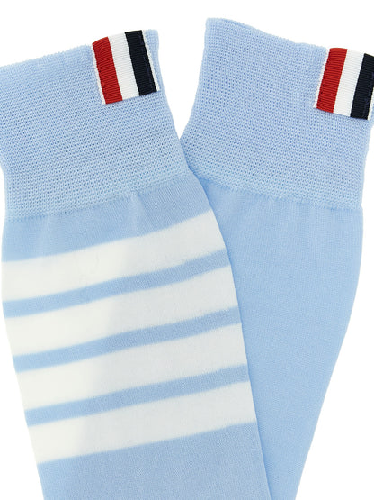 These Socks by Thom Browne for women in polyamide cotton light-blue & signature present a utilitarian silhouette from the Women's Polyamide Cotton Socks collection, offering a utilitarian fit and refined aesthetic.