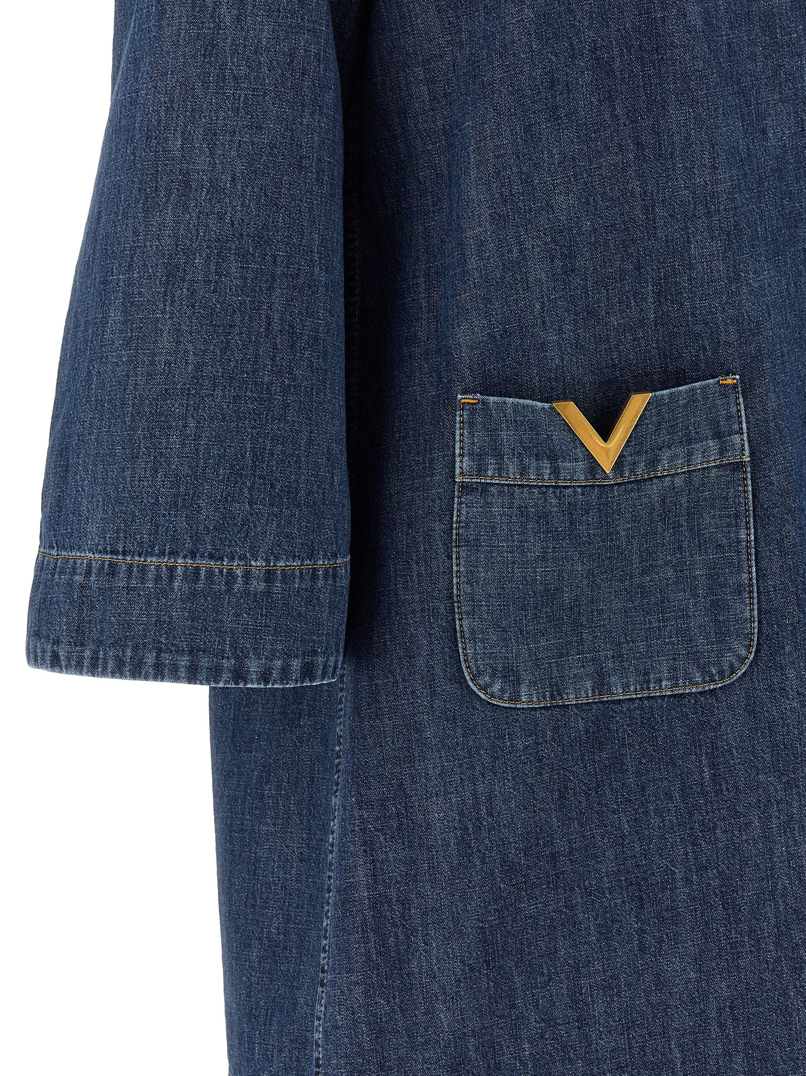 Dress by Valentino Garavani for women in denim cotton blue features an magnificent silhouette, artfully detailed with a magnificent and that flows into an magnificent short.