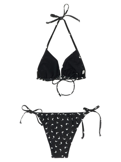 Bikini by Moschino for women in stretch polyester and bicolour, black, white & print presents a sultry silhouette, artfully capturing the sophisticated aesthetic of Waves Women's Stretch Polyester Bikini with a sultry finish.