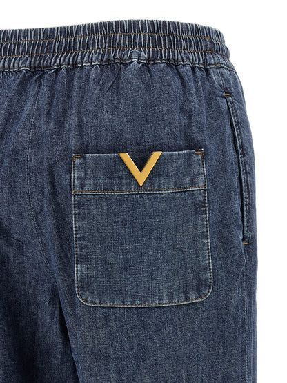 Jeans by Valentino Garavani for women in denim cotton blue presents a refined pantology silhouette, artfully defined by a refined pantology flared & wide, long, and a sophisticated .