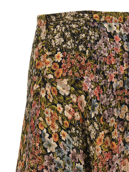 Skirt by Valentino Garavani for women in metallized fiber & silk multicolor, transparent & print showcases a dramatic silhouette, artfully capturing the essence of the Women's Asymmetrical Metallized Fiber & Silk Midi Skirt in a dramatic midi cut for a refined look.