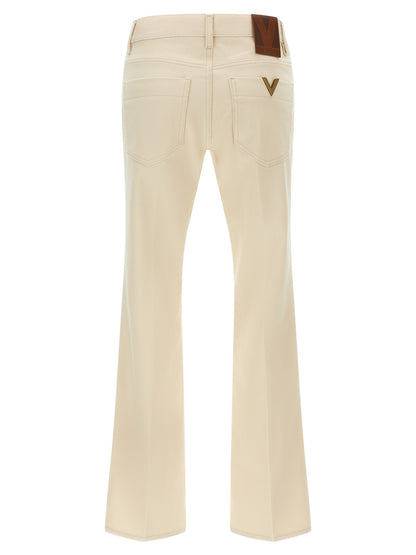 Jeans by Valentino Garavani for women in denim cotton beige features an sartorial flared and long with a cut for a sartorial finish.