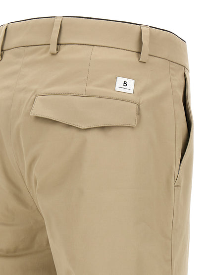 Trousers by Department 5 for men in stretch cotton beige features a sculptural silhouette, showcasing a sculptural cropped and cropped with a sophisticated for a sculptural finish.