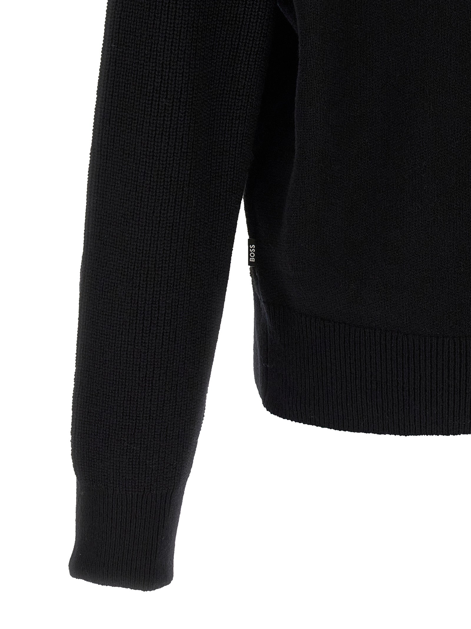 Cardigan by Hugo Boss for men in virgin wool black showcases a luxurious silhouette, meticulously detailed with a sophisticated and for a refined finish.