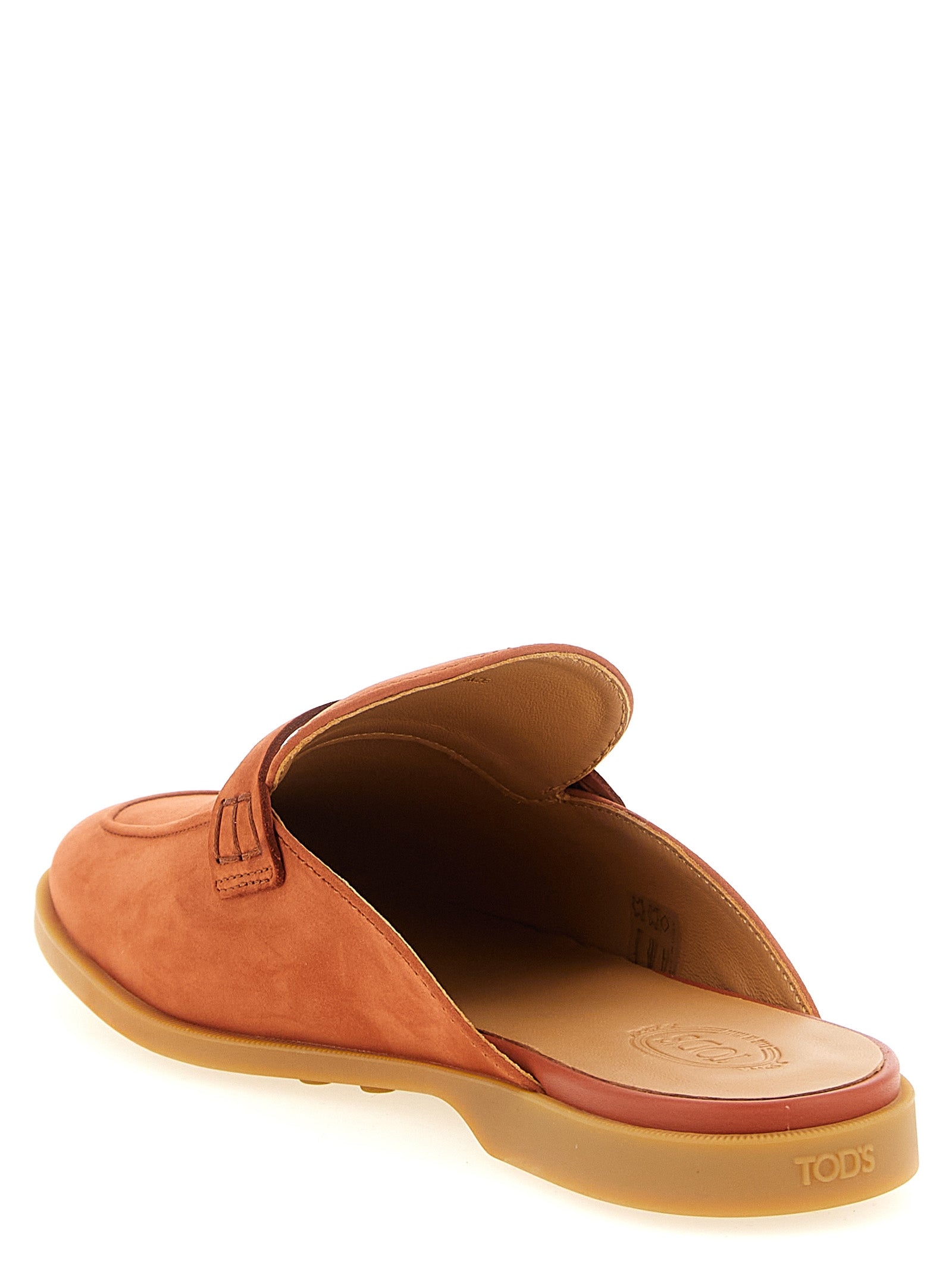 Mules Flat Shoes by Tod's for women in nubuck calfskin leather orange presents a impeccable silhouette as Women's Nubuck Calfskin Leather Mules Flat Shoes, artfully designed with a and a impeccable almond toe style for a refined, upscale finish.