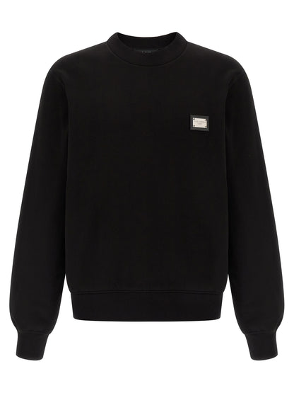 Sweatshirt by Dolce & Gabbana for men in leather & cotton black features an provocated silhouette, detailed with a provocated long-sleeve and a refined crew neckline for a sophisticated aesthetic.