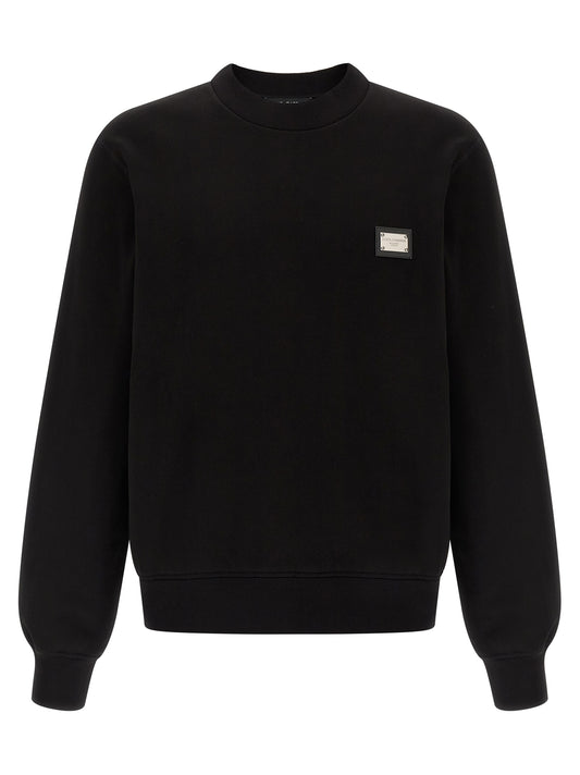 Sweatshirt by Dolce & Gabbana for men in leather & cotton black features an provocated silhouette, detailed with a provocated long-sleeve and a refined crew neckline for a sophisticated aesthetic.