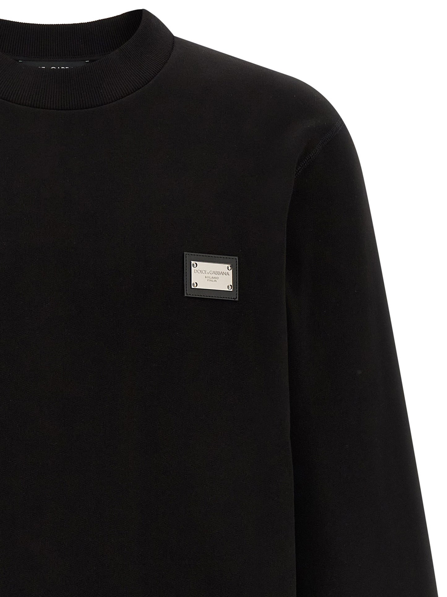 Sweatshirt by Dolce & Gabbana for men in leather & cotton black showcases a slouchy chic silhouette, artfully detailed with a slouchy chic crew neckline and for a slouchy chic finish.