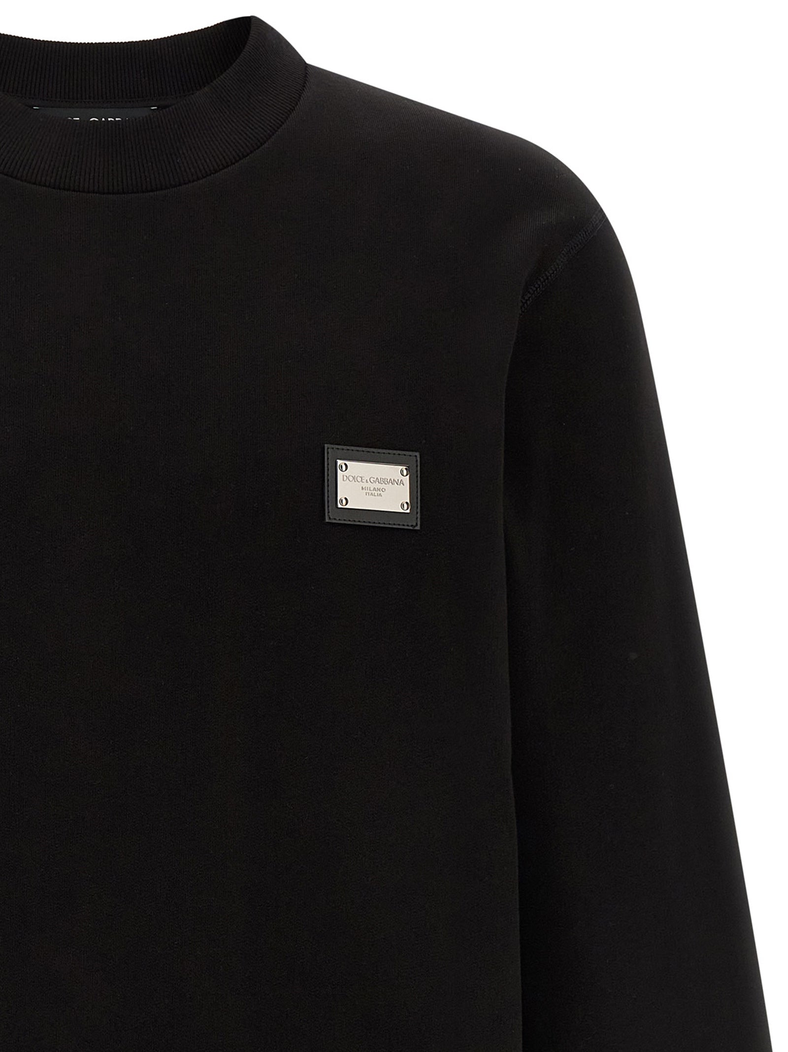 Sweatshirt by Dolce & Gabbana for men in leather & cotton black showcases a slouchy chic silhouette, artfully detailed with a slouchy chic crew neckline and for a slouchy chic finish.