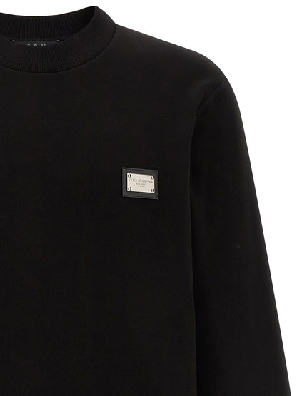 Sweatshirt by Dolce & Gabbana for men in leather & cotton black showcases a slouchy chic silhouette, artfully detailed with a slouchy chic crew neckline and for a slouchy chic finish.