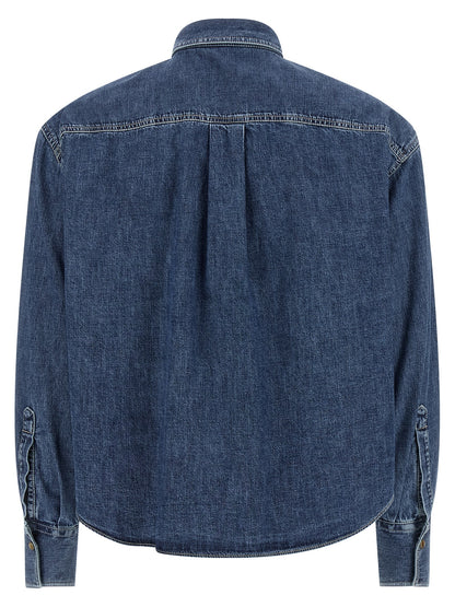 Blouse by Brunello Cucinelli for women in denim cotton blue showcases a sleek silhouette, elegantly detailed with a sleek and for a sleek finish.