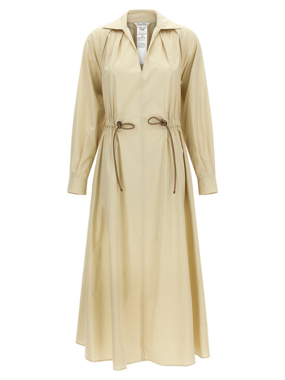 Dress by Max Mara for women in cotton beige features a dramatic silhouette, showcasing an elegant and that flows into a dramatic long.