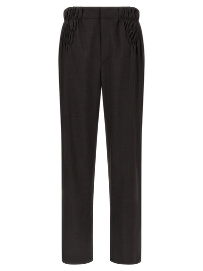 Trousers by Kiko Kostadinov for men in virgin wool brown presents a smart silhouette, meticulously detailed with a smart straight & wide, a smart long, and a smart .