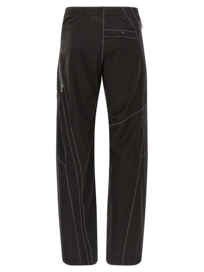 Trousers by Kiko Kostadinov for men in virgin wool brown presents a perennial silhouette, meticulously tailored with a straight-leg cut, long finish, and an elegant .