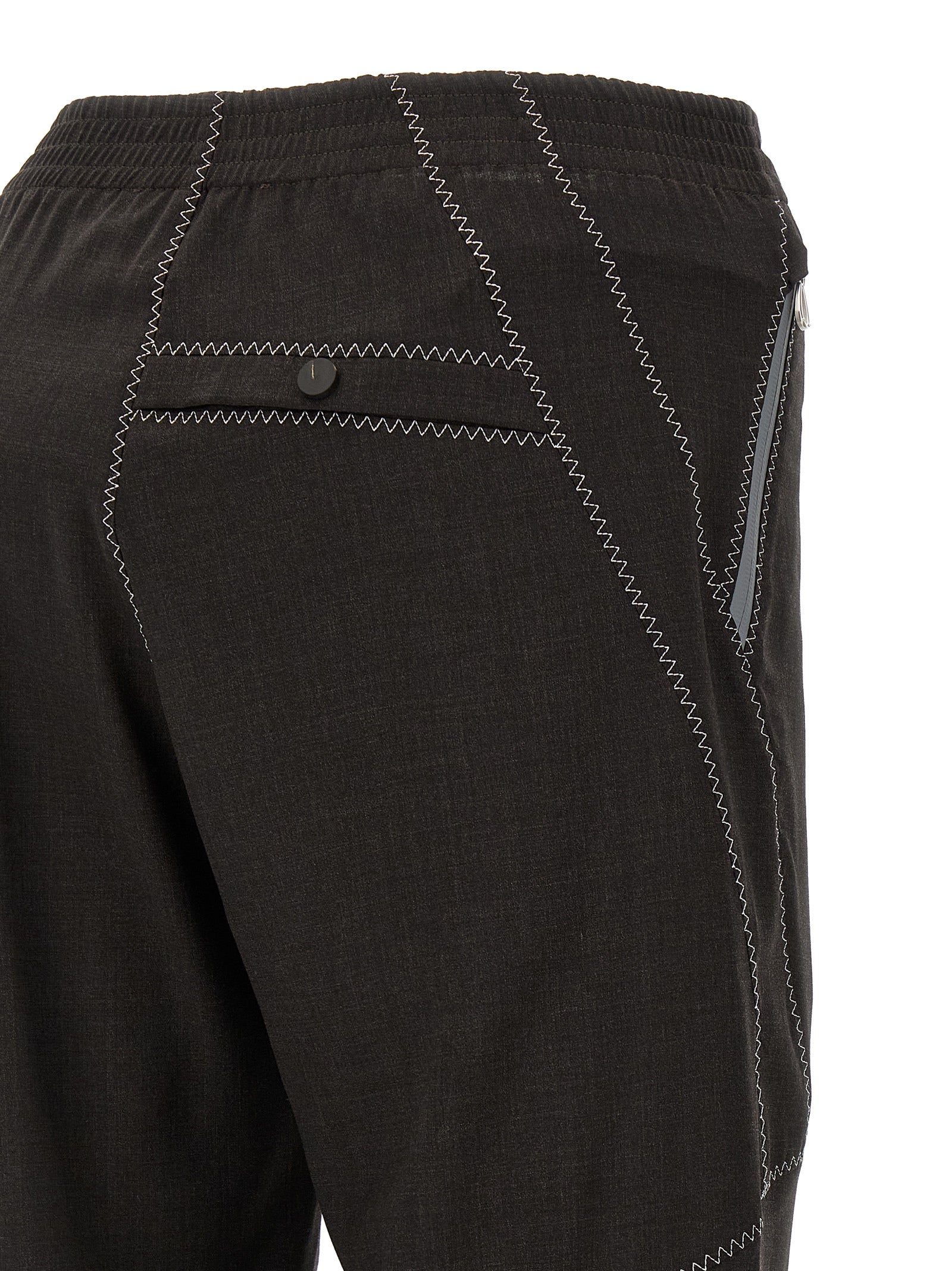 Trousers by Kiko Kostadinov for men in virgin wool brown features a sculptural silhouette, showcasing a sculptural straight-leg and long with a sophisticated for a sculptural finish.