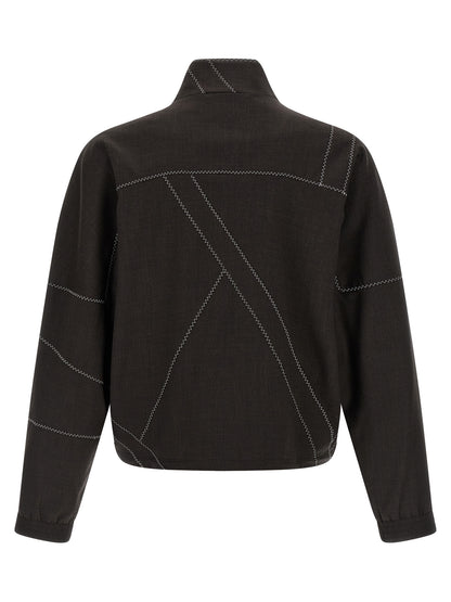 Overcoat by Kiko Kostadinov for men in virgin wool brown showcases a enveloping silhouette, detailed with distinctive pockets and a enveloping high-neck neckline.