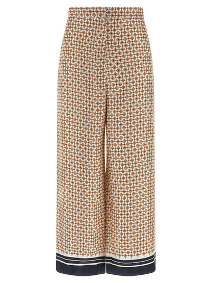 Trousers by Max Mara for women in silk twill blue & print presents a perennial silhouette, meticulously tailored with a straight-leg & wide cut, long finish, and an elegant high rise.