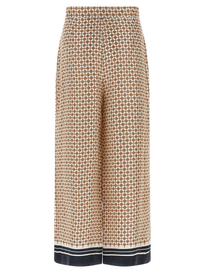 Trousers by Max Mara for women in silk twill blue & print features a sculptural silhouette, showcasing a sculptural straight-leg & wide and long with a sophisticated high rise for a sculptural finish.