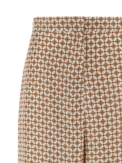 Trousers by Max Mara for women in silk twill blue & print features a artisanal silhouette, showcasing a sophisticated straight-leg & wide with a long and high rise for a artisanal finish.