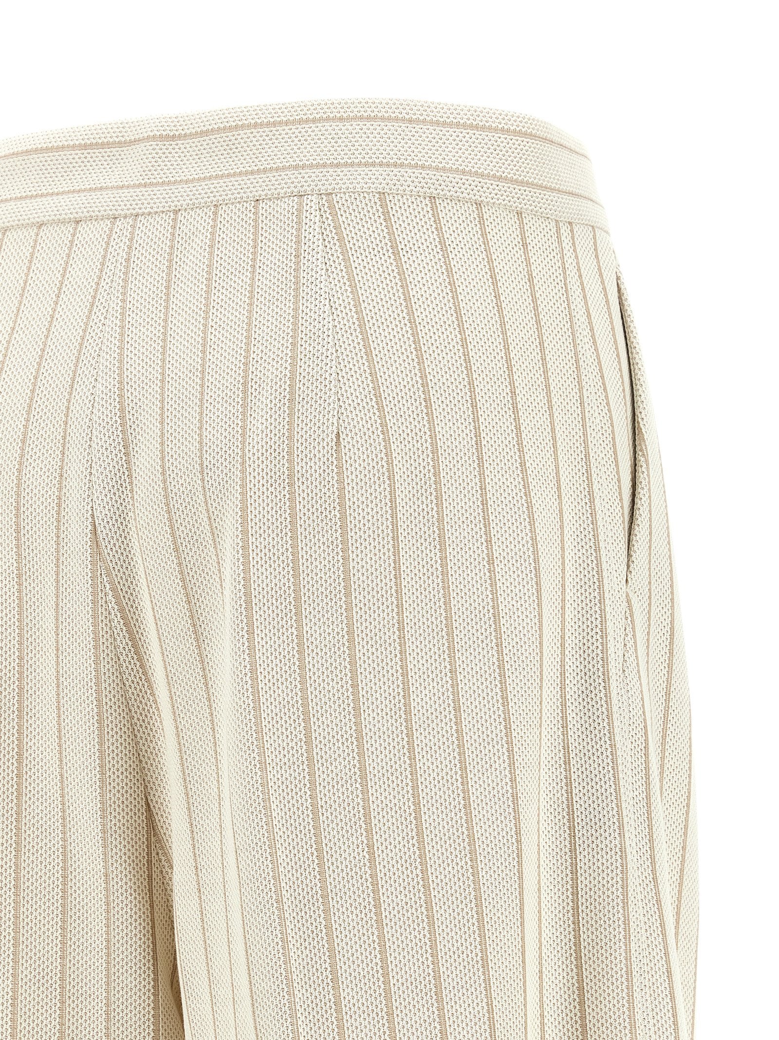 Trousers by Max Mara for women in cotton white & pinstripe presents a perennial silhouette, meticulously tailored with a wide cut, long finish, and an elegant high rise.