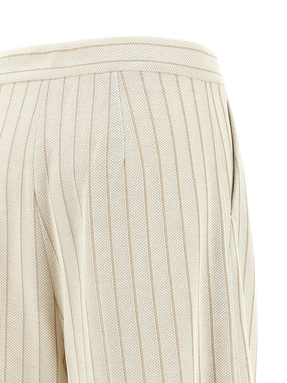 Trousers by Max Mara for women in cotton white & pinstripe presents a perennial silhouette, meticulously tailored with a wide cut, long finish, and an elegant high rise.
