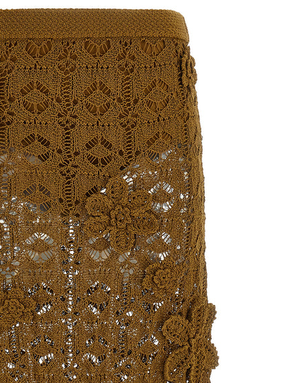 Skirt by PINKO for women in cotton brown & floral showcases a sultry silhouette, elegantly defined by its midi and the sophisticated sultry design of the Crochet Women's Flared High Rise Cotton Midi Skirt.