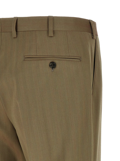 Pant Suit by Brioni for men in cupro wool bicolour, green & herringbone showcases a sartorial silhouette, artfully detailed with a sophisticated and a sartorial slim for a refined, high-fashion aesthetic.