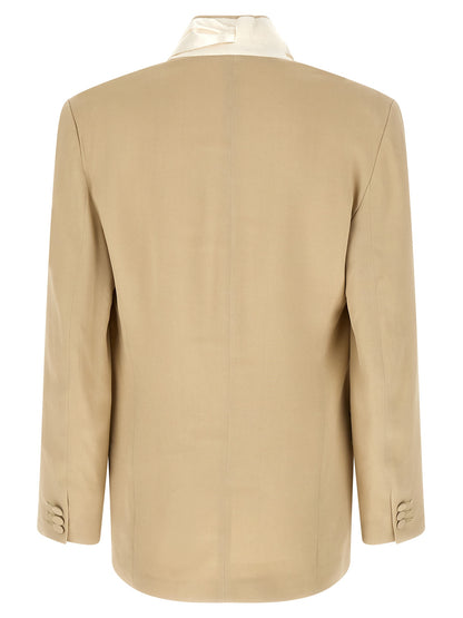 This Blazer by Magliano for men in viscose linen & cupro beige & monogram presents a tailored silhouette, meticulously tailored with a tailored and distinctive for a tailored finish.
