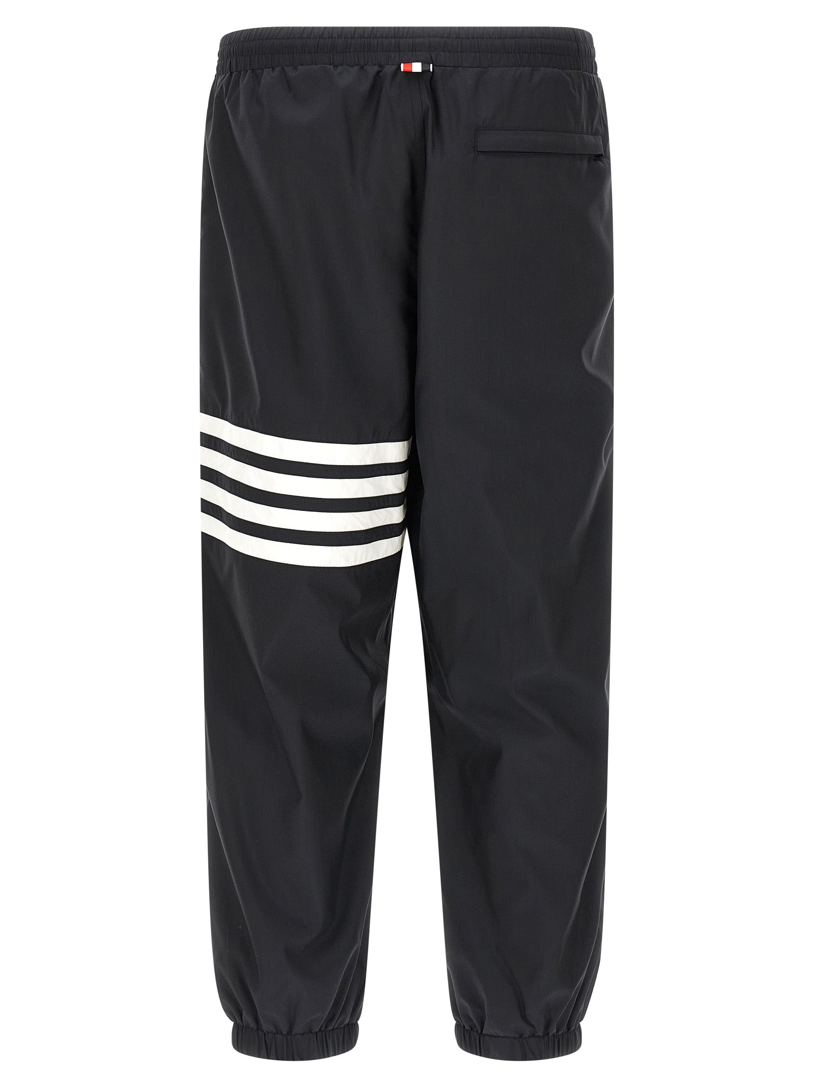 Joggers by Thom Browne for men in polyamide & polyester blue & print presents a tailored silhouette, showcasing a tailored straight-leg and long cut with a refined for a truly tailored aesthetic.