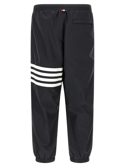 Joggers by Thom Browne for men in polyamide & polyester blue & print presents a tailored silhouette, showcasing a tailored straight-leg and long cut with a refined for a truly tailored aesthetic.