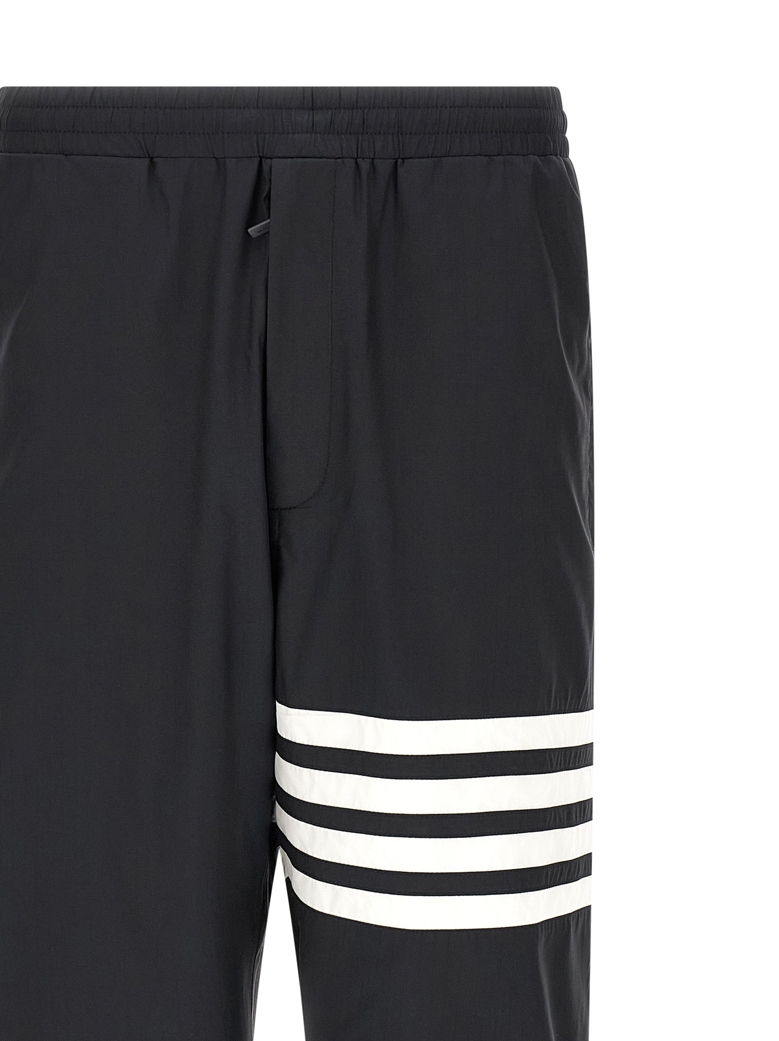 Joggers by Thom Browne for men in polyamide & polyester blue & print features a polished silhouette with a polished straight-leg, reaching a polished long and finished with a polished .