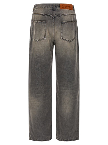 Jeans by SÉFR for men in denim cotton & suede leather black features a polished silhouette with a polished wide, reaching a polished long and finished with a polished mid rise.