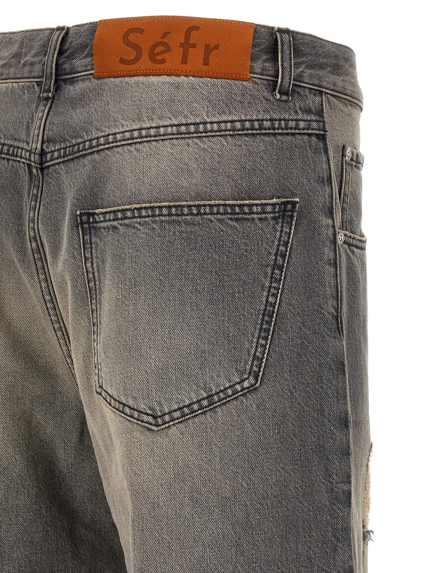 Jeans by SÉFR for men in denim cotton & suede leather black presents a refined pantology silhouette, artfully defined by a refined pantology wide, long, and a sophisticated mid rise.