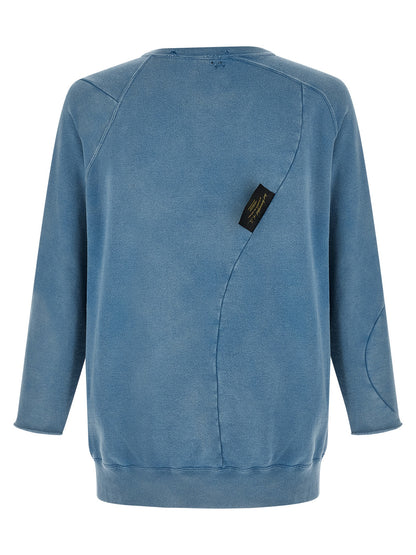 Sweatshirt by Undercover for men in cotton light-blue & print showcases a slouchy chic silhouette, artfully detailed with a slouchy chic crew asymmetric neckline and for a slouchy chic finish.