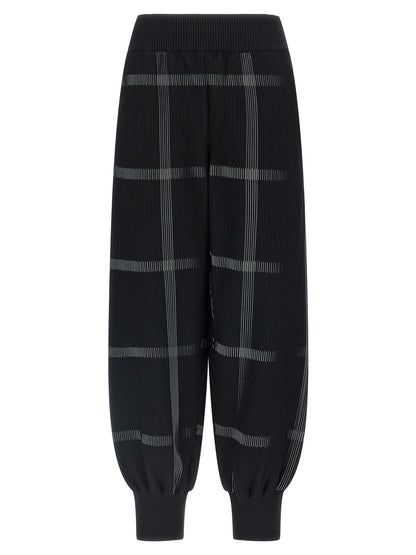Casual Pants by PLEATS PLEASE ISSEY MIYAKE for women in polyester & nylon black & patterned features a polished silhouette with a polished wide, reaching a polished long and finished with a polished .