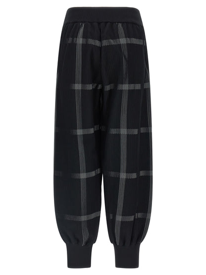 Casual Pants by PLEATS PLEASE ISSEY MIYAKE for women in polyester & nylon black & patterned features an refined tailoring silhouette, showcasing a premium wide with a and long cut for a refined tailoring look.
