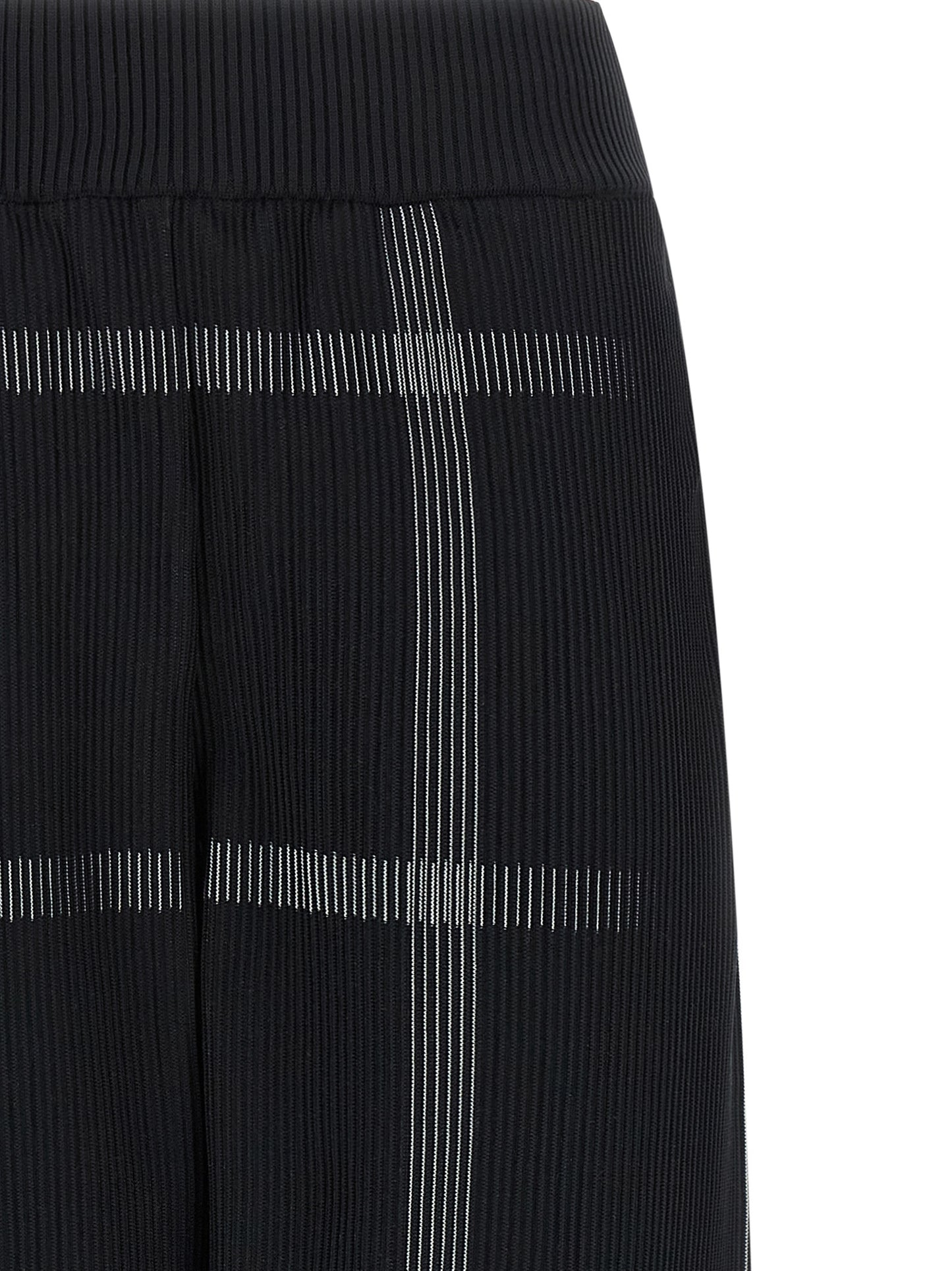 Casual Pants by PLEATS PLEASE ISSEY MIYAKE for women in polyester & nylon black & patterned presents a tailored silhouette, showcasing a tailored wide and long cut with a refined for a truly tailored aesthetic.