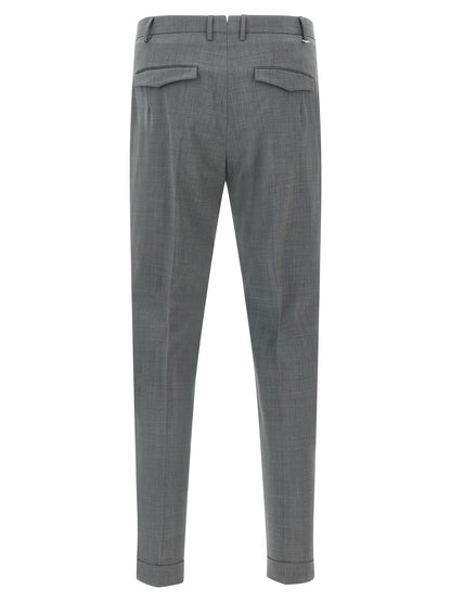 Trousers by PT Torino for men in virgin wool gray presents a perennial silhouette, meticulously tailored with a cut, long finish, and an elegant mid rise.