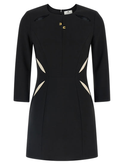 Dress by Elisabetta Franchi for women in stretch polyester bicolour, black & white features an eye catching silhouette with a sophisticated , elegant long-sleeve, and a refined short mini for a eye catching aesthetic.