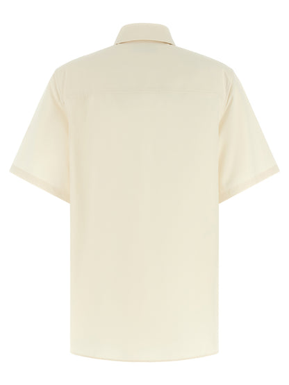 Blouse by Ferragamo for women in cotton & silk beige, pearl & signature showcases a sleek silhouette, elegantly detailed with a sleek asymmetric neckline and for a sleek finish.