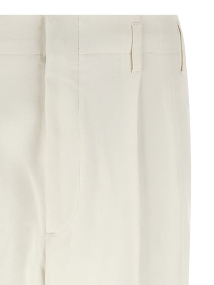 Trousers by Brunello Cucinelli for men in cotton white presents a perennial silhouette, meticulously tailored with a tapered-leg cut, long finish, and an elegant high rise.