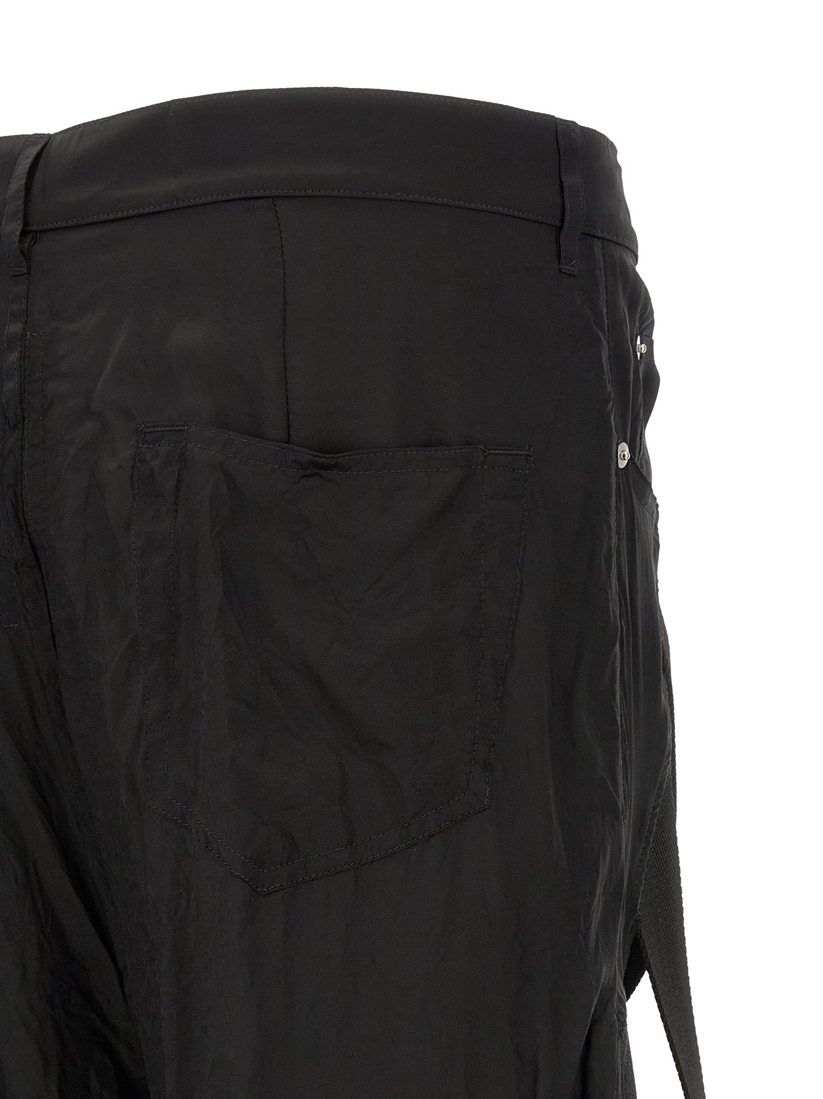 Trousers by Rick Owens for men in cupro & copper black & copper presents a smart silhouette, meticulously detailed with a smart flared & wide, a smart long, and a smart high rise.