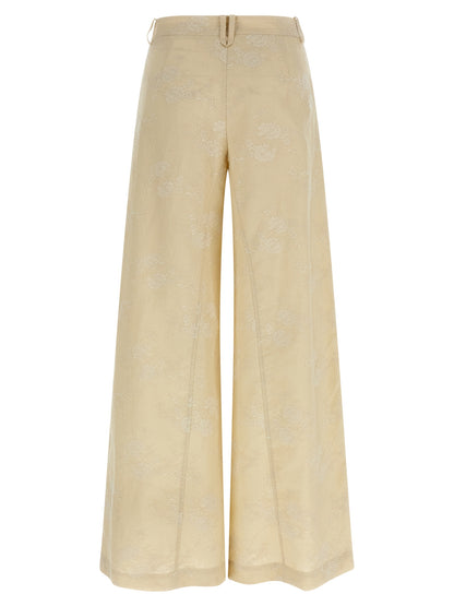 Trousers by PINKO for women in linen beige features a tailored silhouette with a tailored flared & wide, defined by its long and a sophisticated mid rise.